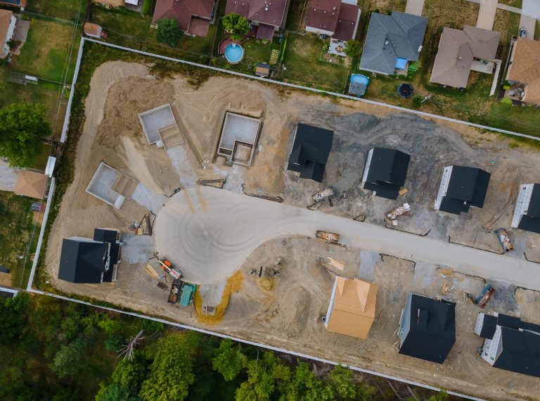A residential aerial view of a new housing development being built of a new home under construction