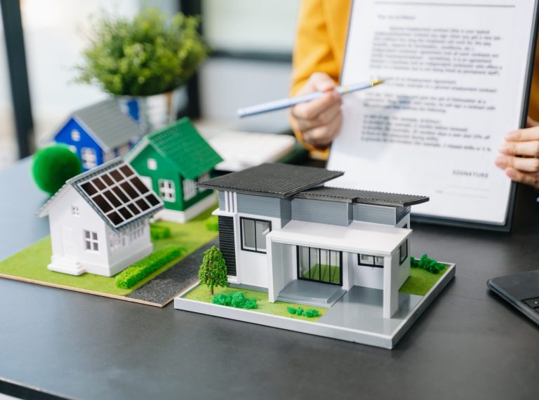 Signing a contract. Client and broker agent, lease agreement, successful deal and  Young business sitting at the desk in office